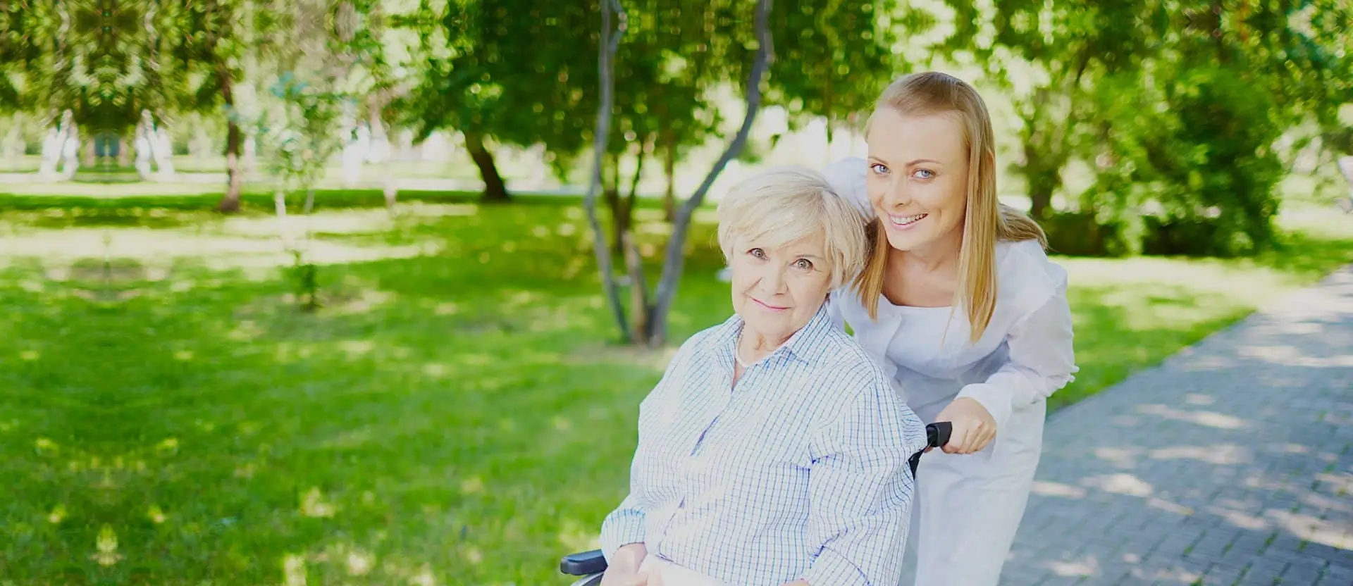 caregiver and patient strolling outside