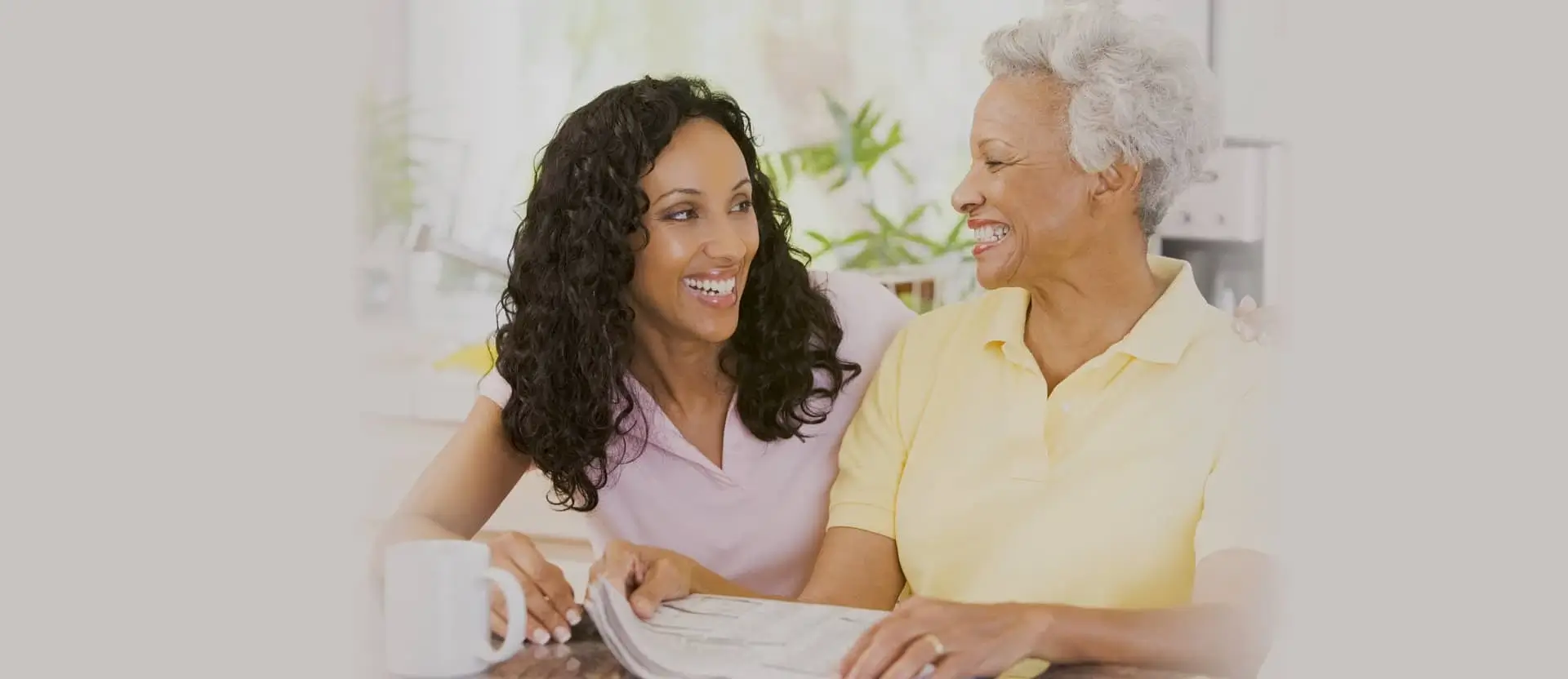 caregiver and patient smiling at each other